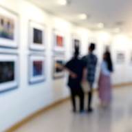 A group of people looking at a wall with pictures

AI-generated content may be incorrect.