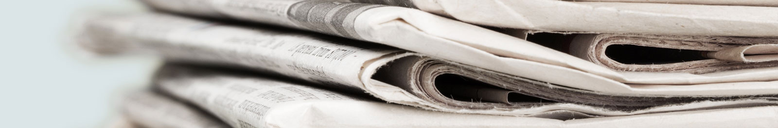 A close up of a newspaper
AI-generated content may be incorrect.