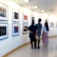 A group of people looking at a wall with pictures

AI-generated content may be incorrect.